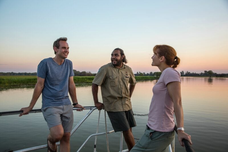 Visitors with a Aboriginal guide aboard a Yellow Water Billabong cruise.