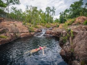 Woman floating in water at Bulley Rockhole in Litchfield National Park