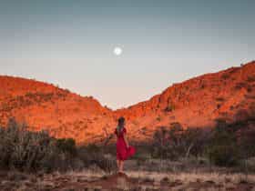A woman exploring the West MacDonnell Ranges