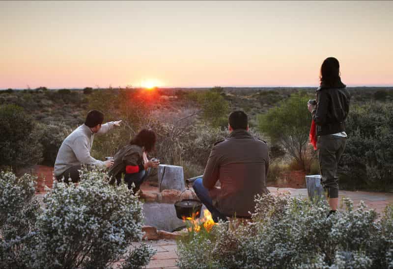 When sunrise comes watch the distant domes of Kata Tjuta come into view.