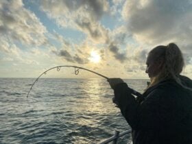Girl fishing in the ocean