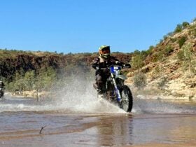 Rider negotiating a water crossing in Finke Gorge National Park