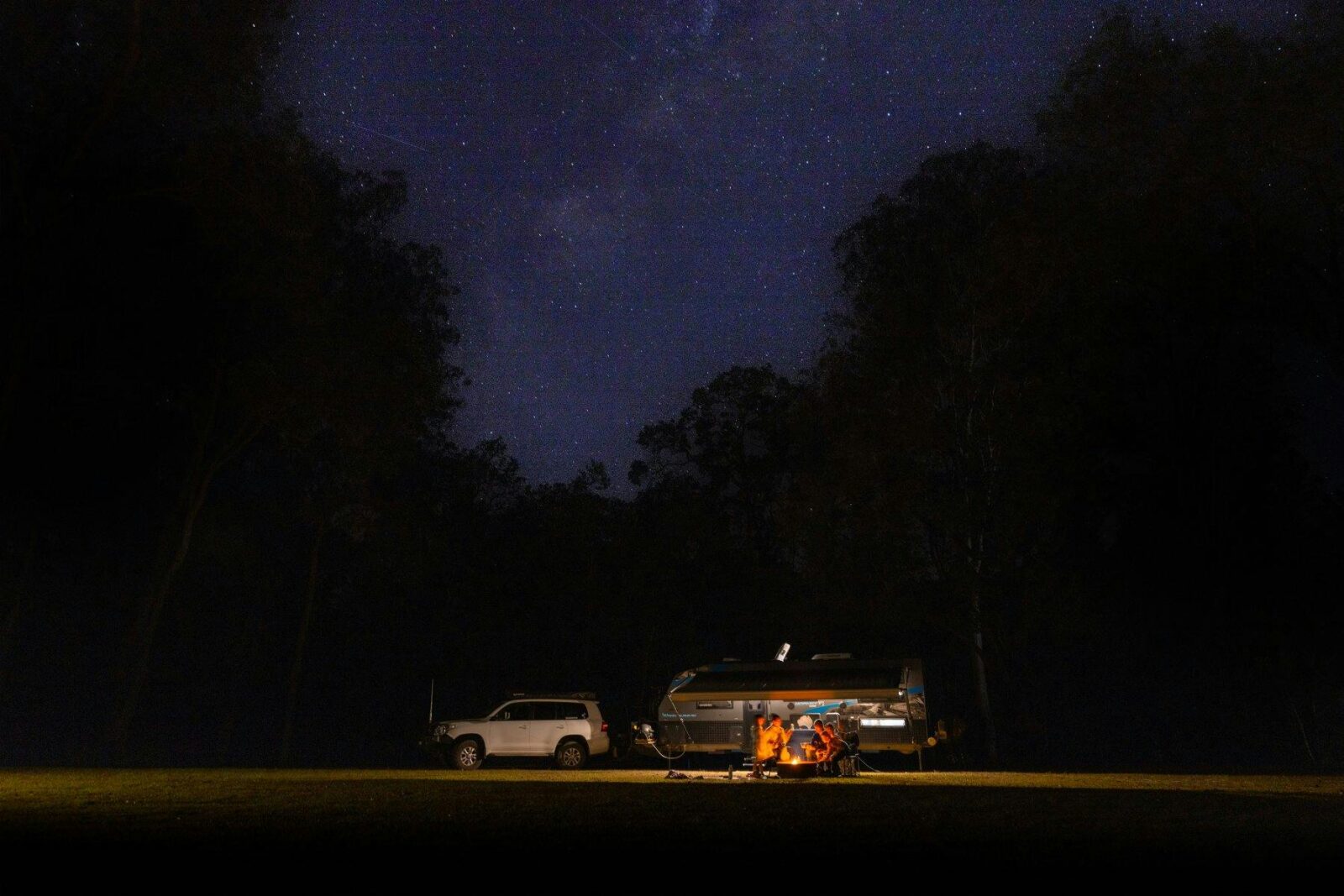 Campers camping under the stary night