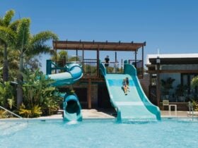 Two waterslides into a crystal clear pool
