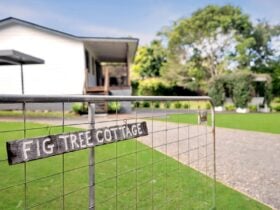 Cottage entry with Fig Tree Cottage Sign on gate