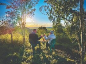 A Couple enjoying the sunset lookout at Kiambram Country Cottages