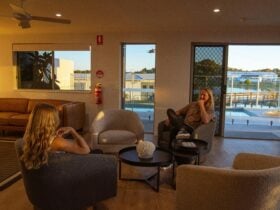 Shared lounge area over looking the pool Mackay Adventure Lodge