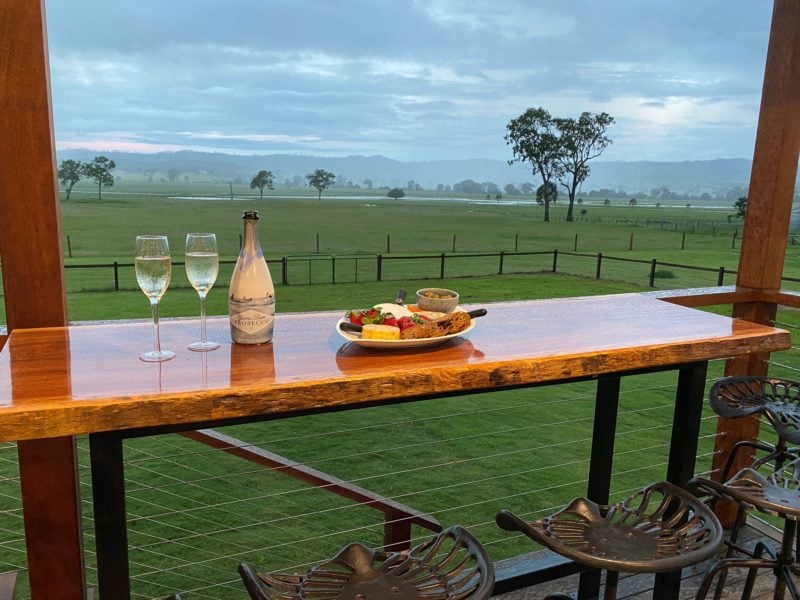 Relax on this spacious deck and enjoy the view overlooking a working beef cattle property.