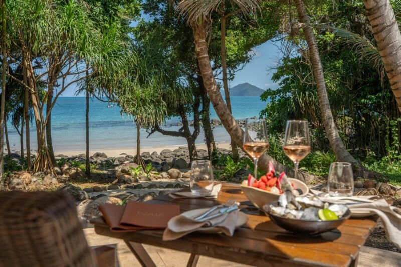 Outdoor dining at Nala Resort, Tropical drinks, curated wine list with views of Dunk Island