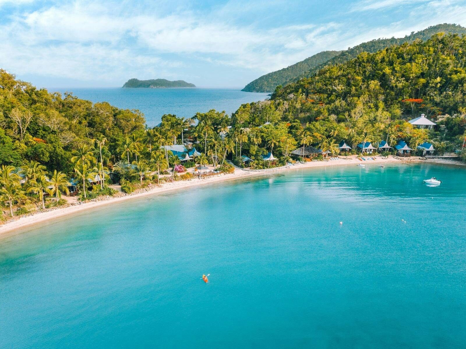 Wide shot of island with beach.