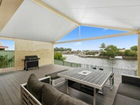 Outdoor entertaining area with canal views