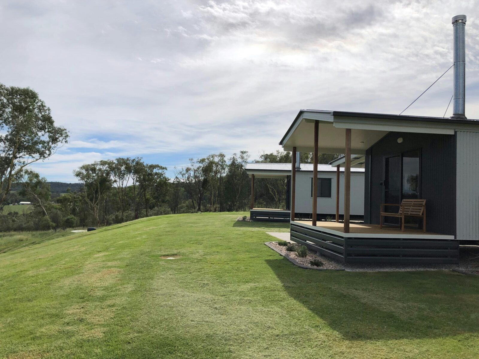 view of two cabins and surrounding