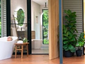 Guest relaxing in outdoor bath on the deck at Spring Haven Kuranda