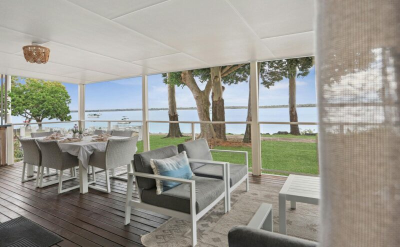 Covered veranda with river views