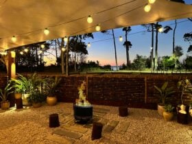 Vila Paus Satu at sunset. Stunning views of the ocean, beautifully lit with festoon lighting.