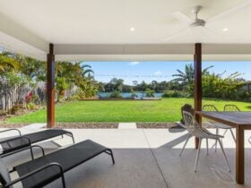 Covered private outdoor living with views out to Lake Kalvert
