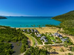 Yangaro from above - drone pic looking north over the 7 houses + Clubhouse, Funnel Bay background