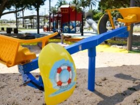 Blue and yellow childrenâs cycle play equipment at Beth Boyd Park, Thorneside, Redlands Coast.