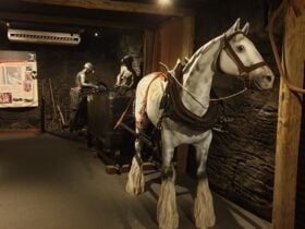 Statue of horse and two miners loading coal into carriage