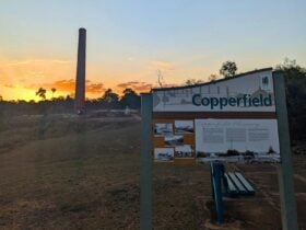 Copperfield Chimney and informative sign at sunset