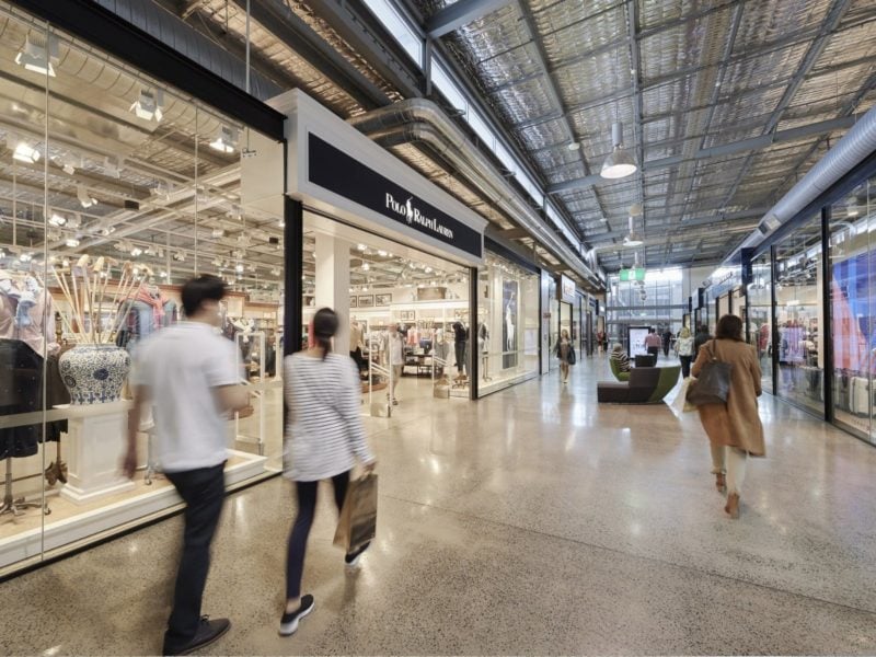 Customers walking the Polo Ralph Lauren mall