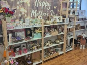 A vibrant Mother’s Day retail display filled with handcrafted items