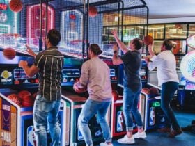 Men shooting basketballs