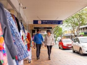 A couple walking down Mary Street