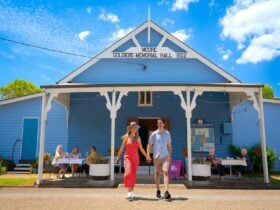 Couple walking out of the blue Moore Soldiers Memoral Hall