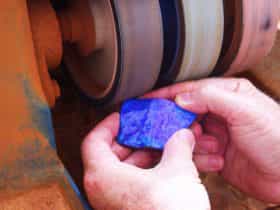 piece of opal being cut and polished
