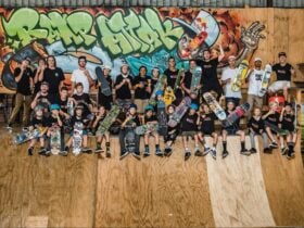 Adult and child skateboarders on a skateboard ramp