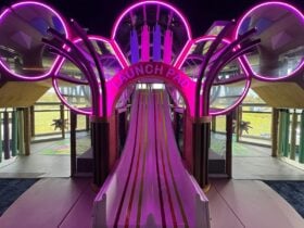 Photo of Brothers kids room featuring the slide and neon lights