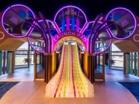 Photo of Brothers kids room featuring the slide and neon lights