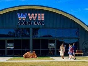 Front entrance of the base with a family of four walking towards the front entrance on a clear day