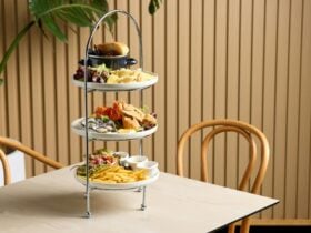 Seafood tower on table set for two
