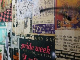 A wall of music and event posters with a grunge feeling