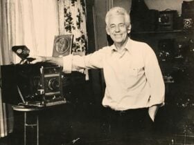 photographer R G Parry standing with camera