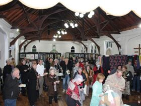 Crowds gather to view and buy art and to mingle and chat