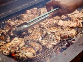 Chicken cooking on coals