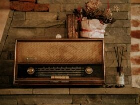 Brisbane by Matthew Ryan. Poster features a retro radio on a stone mantlepiece.