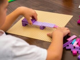 Kid playing with purple logos