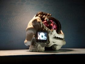 A 3d printed skull that has a digital screen for an eye