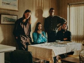 Dry Cleaning (band) sitting at a table