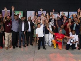 People enjoying a multicultural Eid community festival.