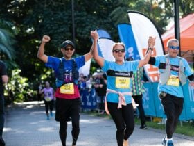 runners finishing run and crossing the finish line