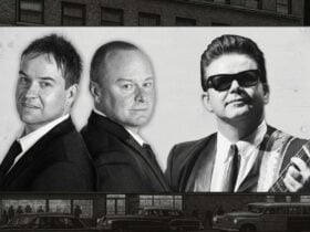 Robertson Bros back to back with a Roy Orb looking man with sunglasses on the right