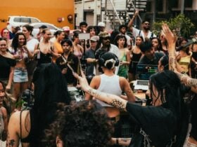 Family Tree - a group of people watching and dancing around a DJ, who is in the middle