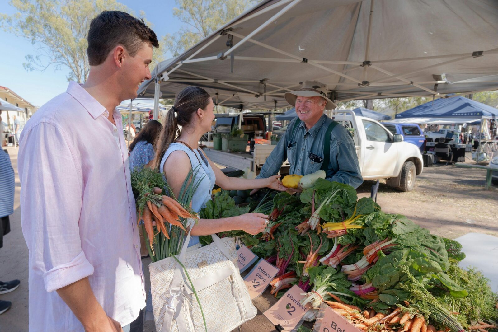 Couple buying farm fresh produce at the markets