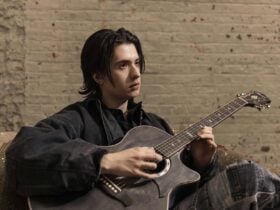 Marcin holding guitar