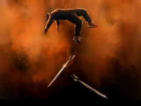 Someone floating on their back with an orange dust falling above. Two swords floating below